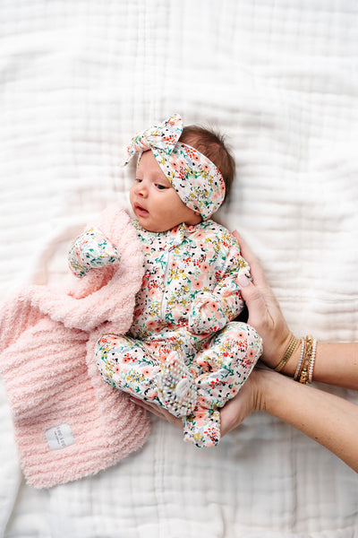 Millie Zipper Footies Newborn girl in newborn size with matching millie headband and blush chenille mini blanket