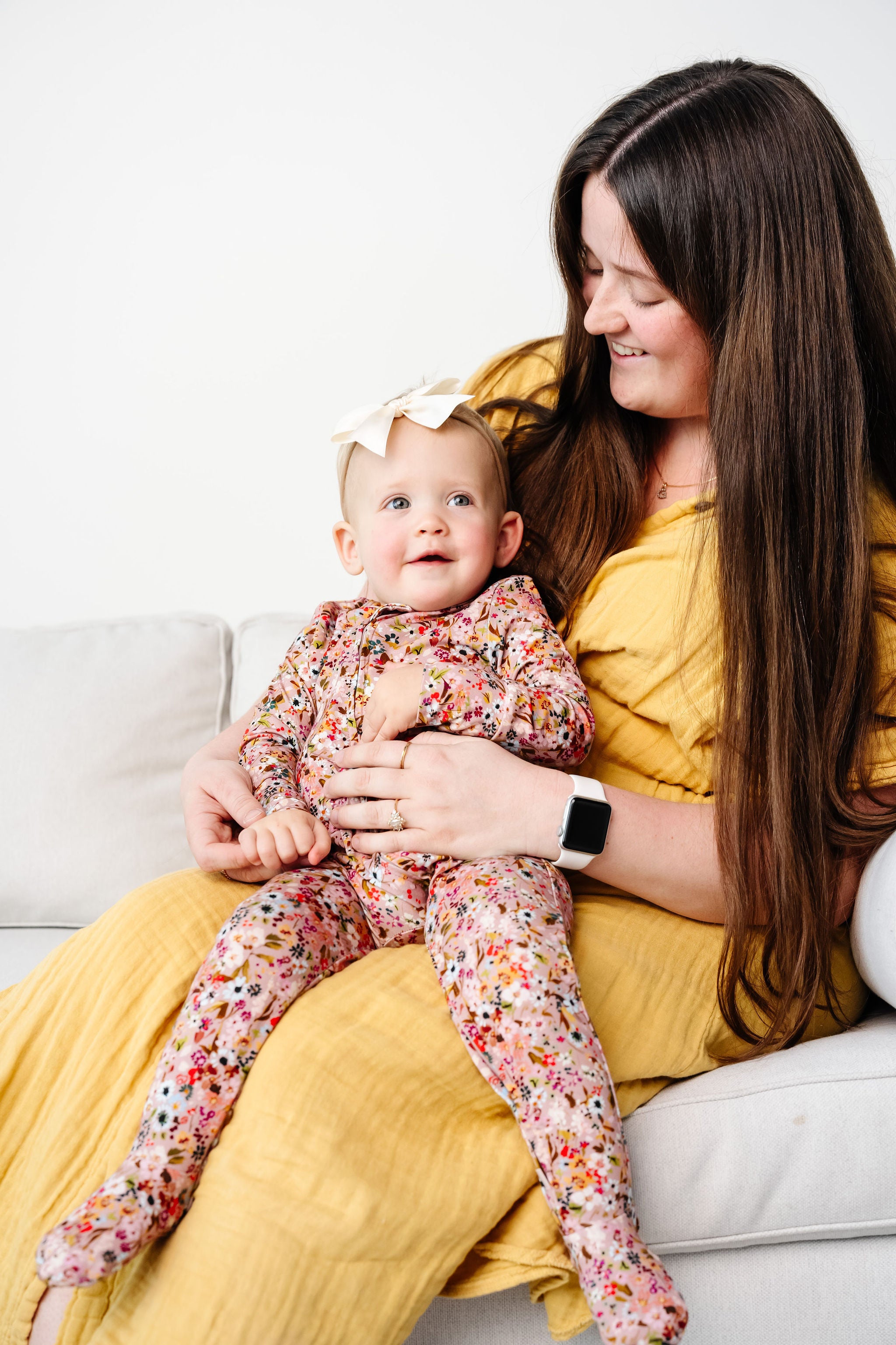 Penelope Zipper footies toddler girl in 12-24 month size sitting on mom's lap