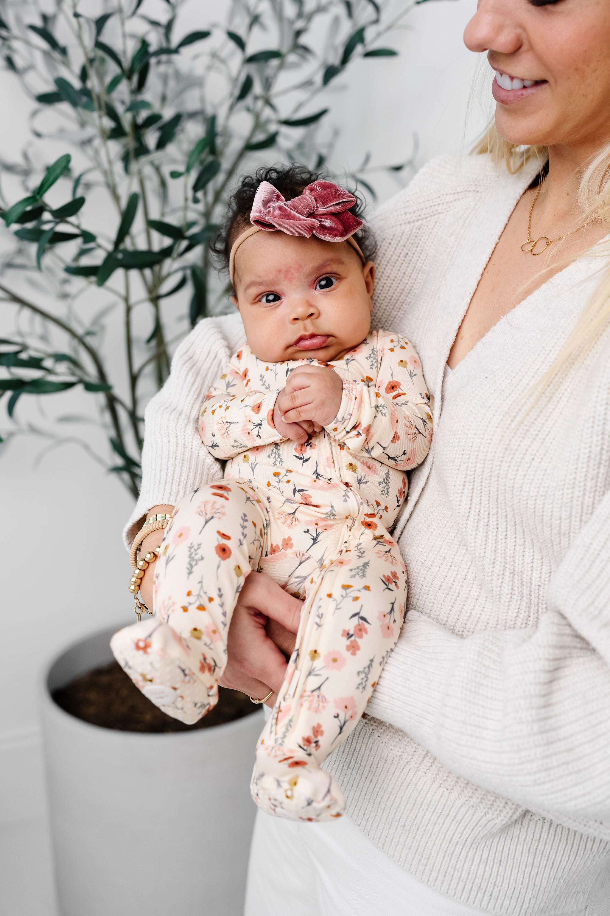 rachel zipper footies newborn girl being held by Karen. Rose Velvet