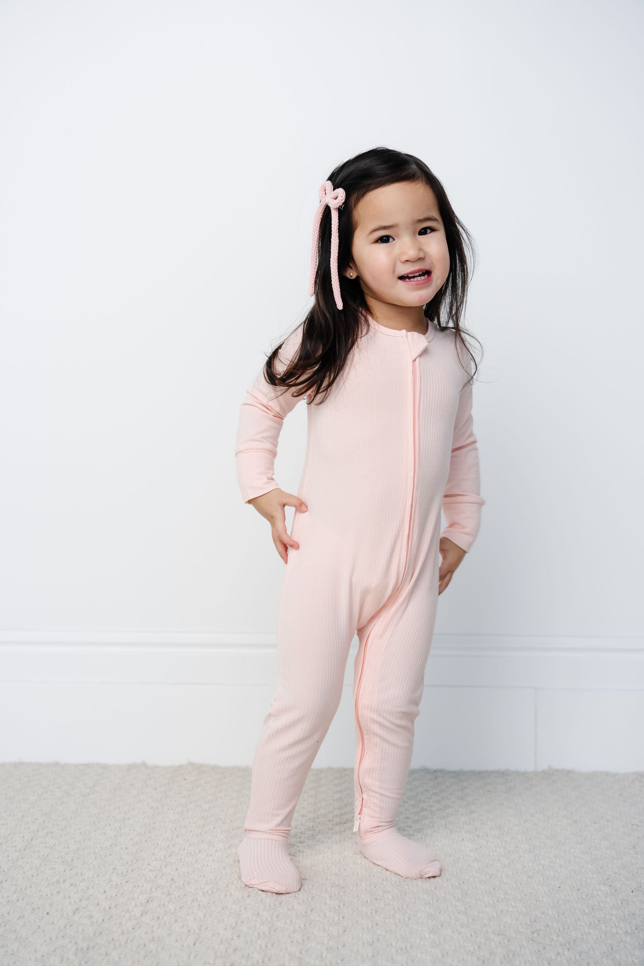 Rosie zipper footies toddler girl wearing 2T size standing up