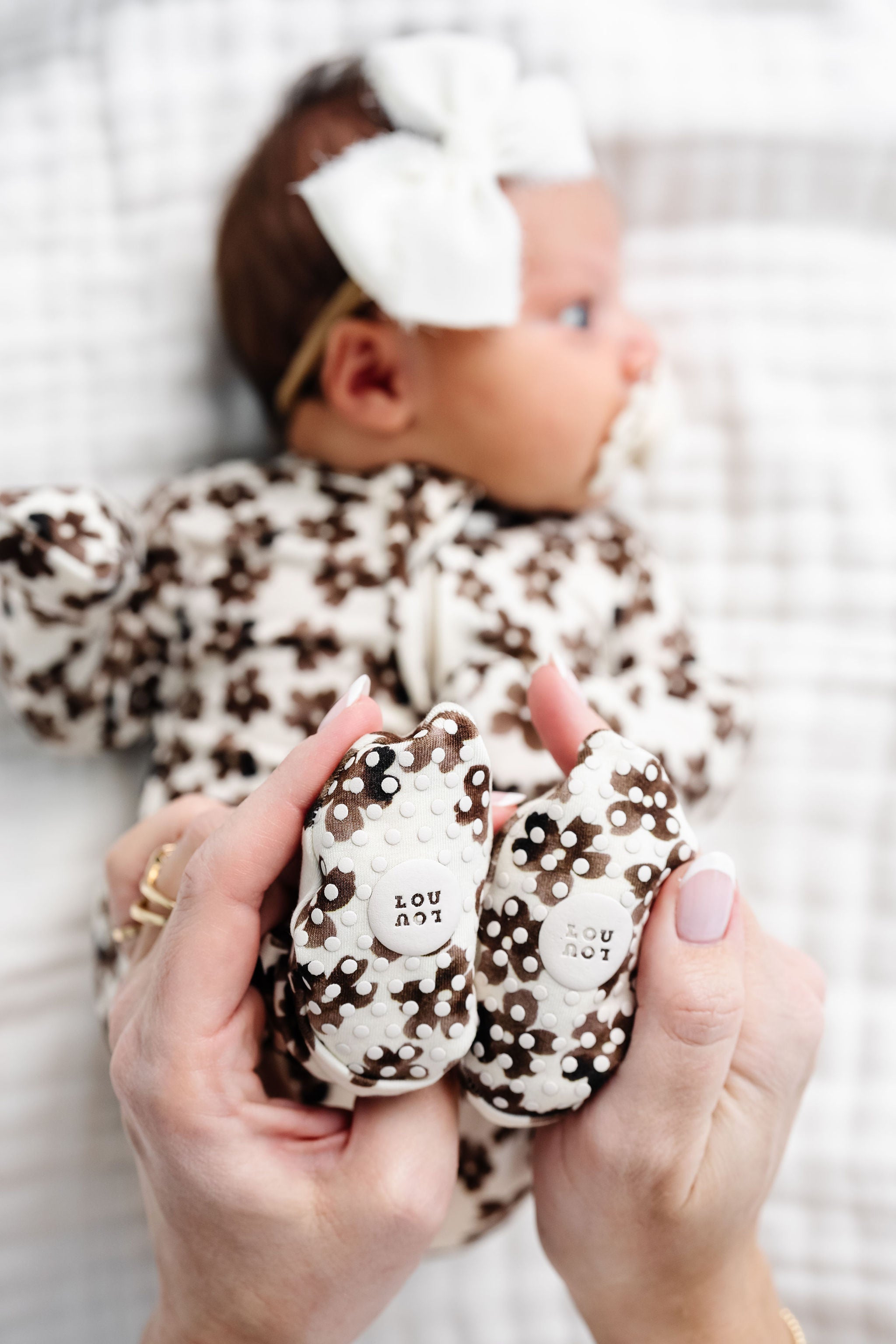 Sloane Zipper Footies newborn girl focus on footie grips