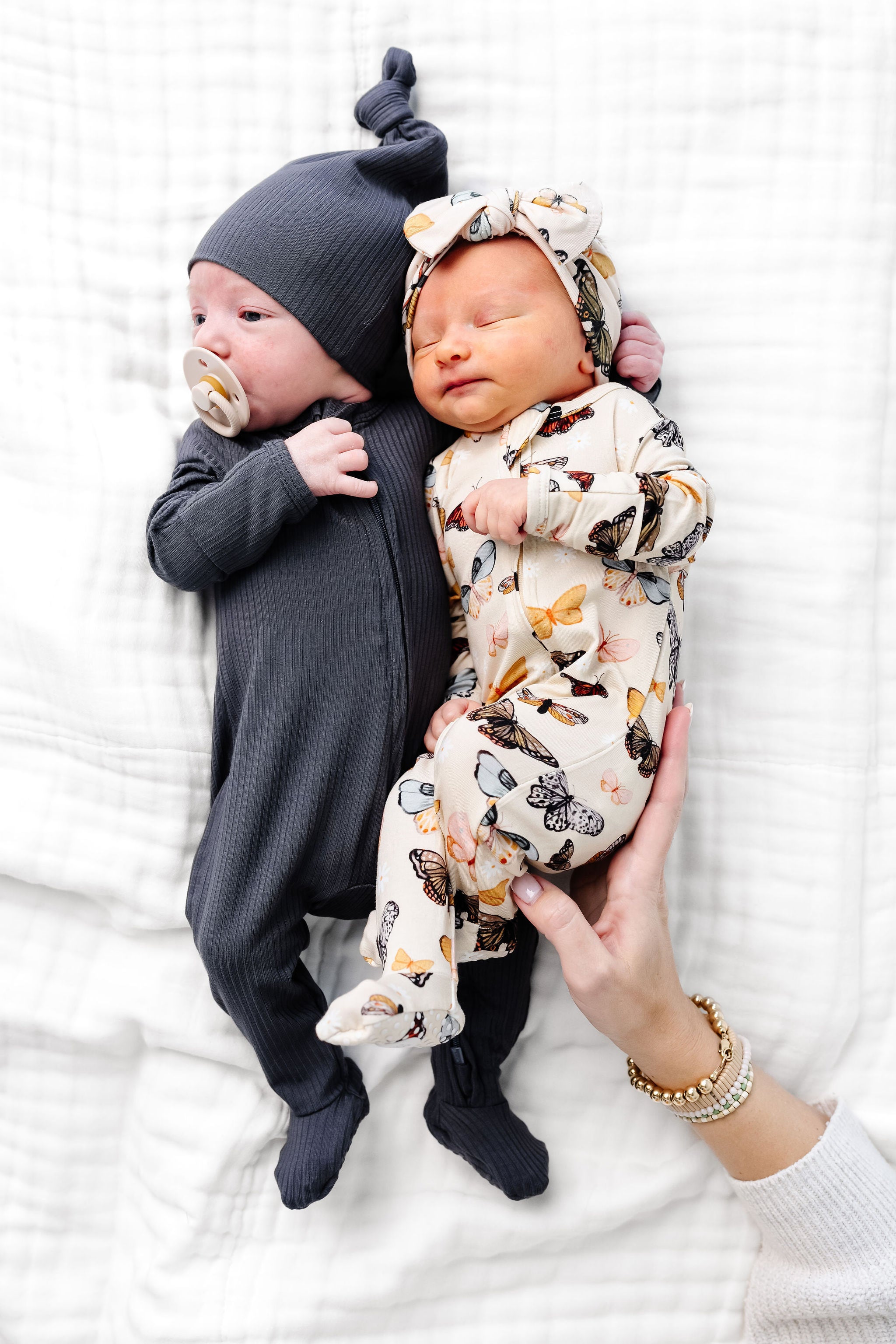 amelia hudson zipper footies newborn baby girl and boy laying on bed