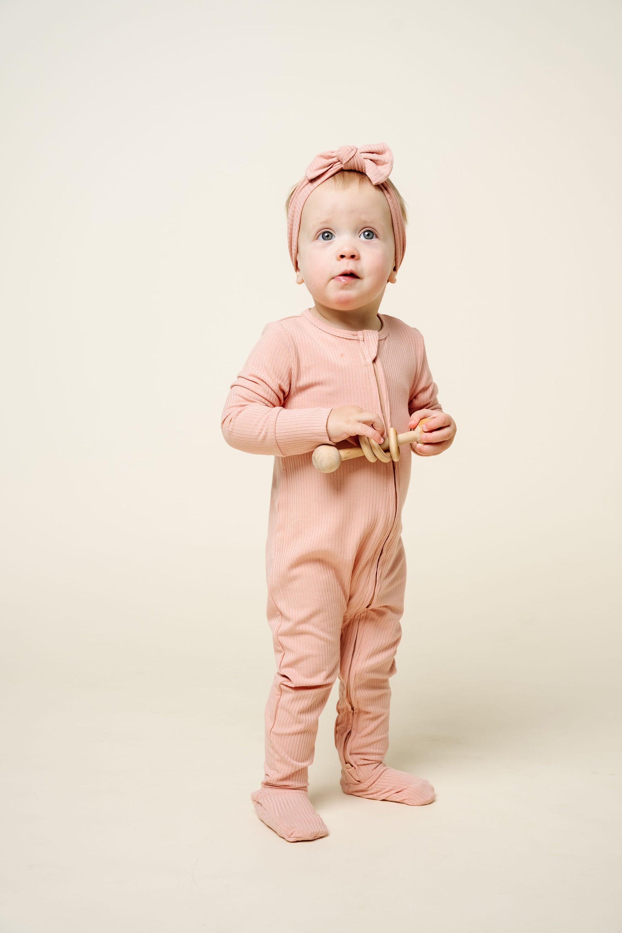 audrey zipper footies toddler girl wearing 12-24 month size with matching audrey headband