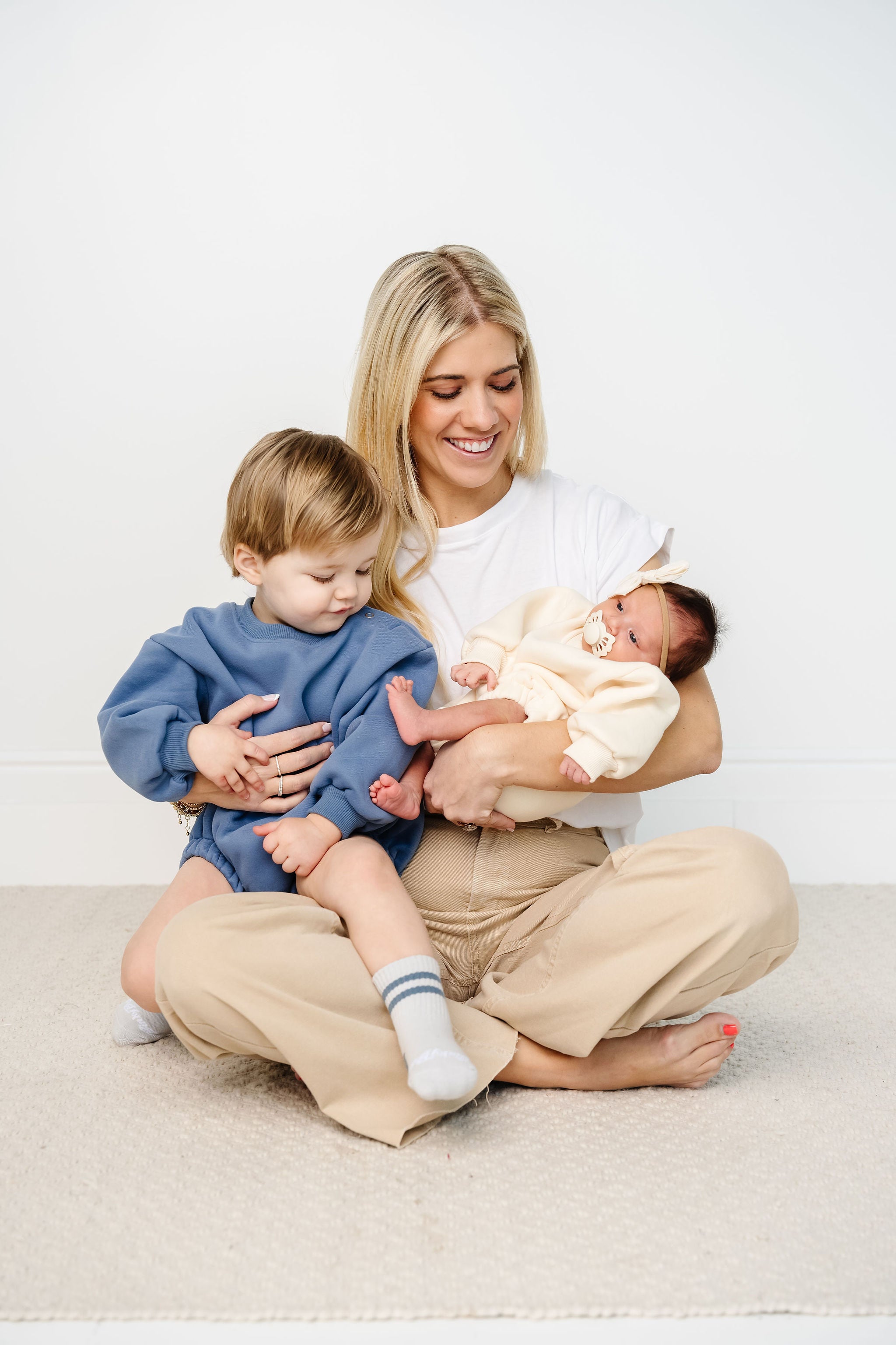 cadet cream sweatshirt romper toddler boy baby girl sitting with karen