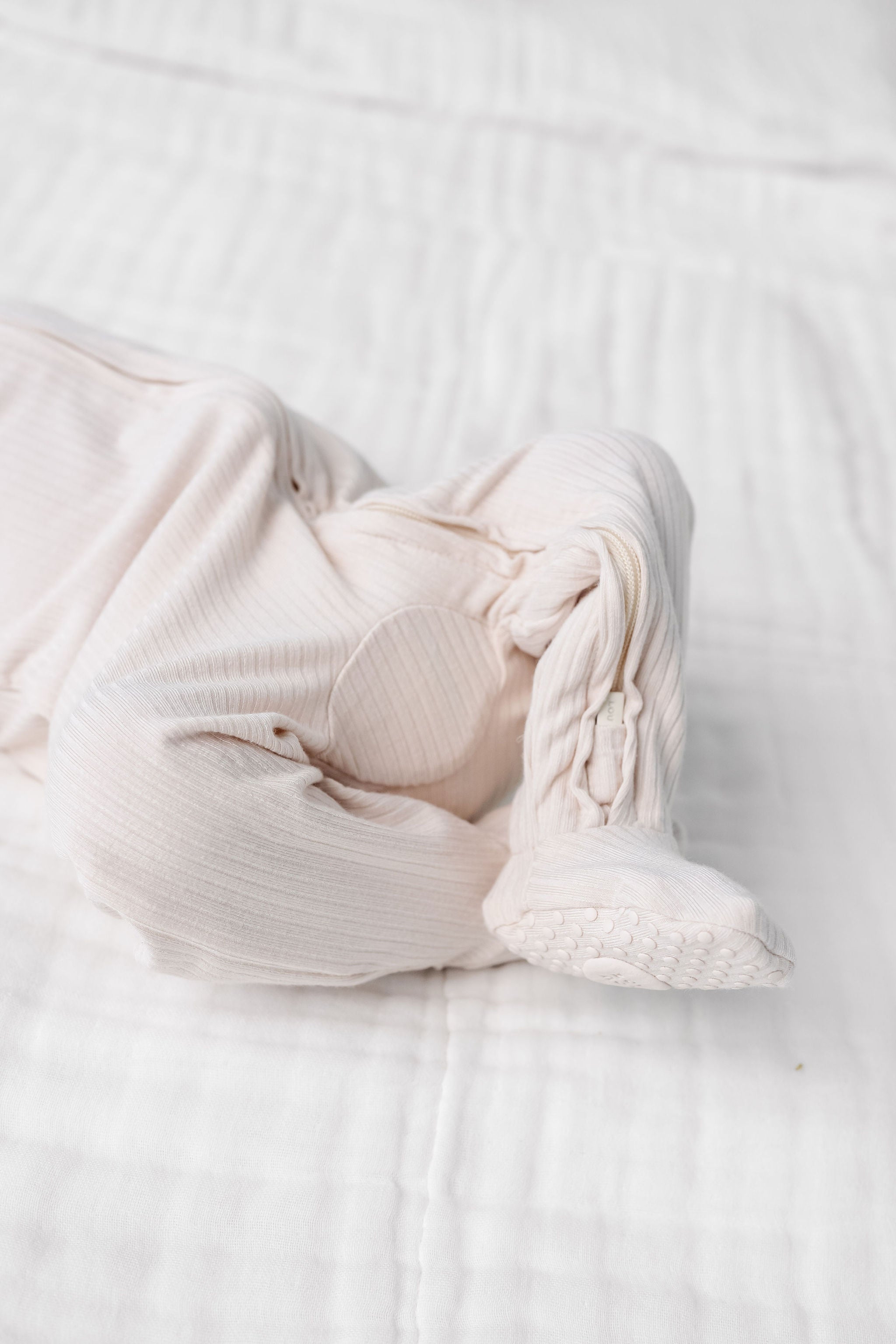 cove zipper footies close up on print and footie