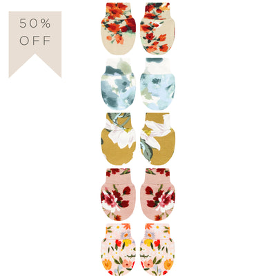 Set of floral-patterned baby socks with a 50% off label on a white background