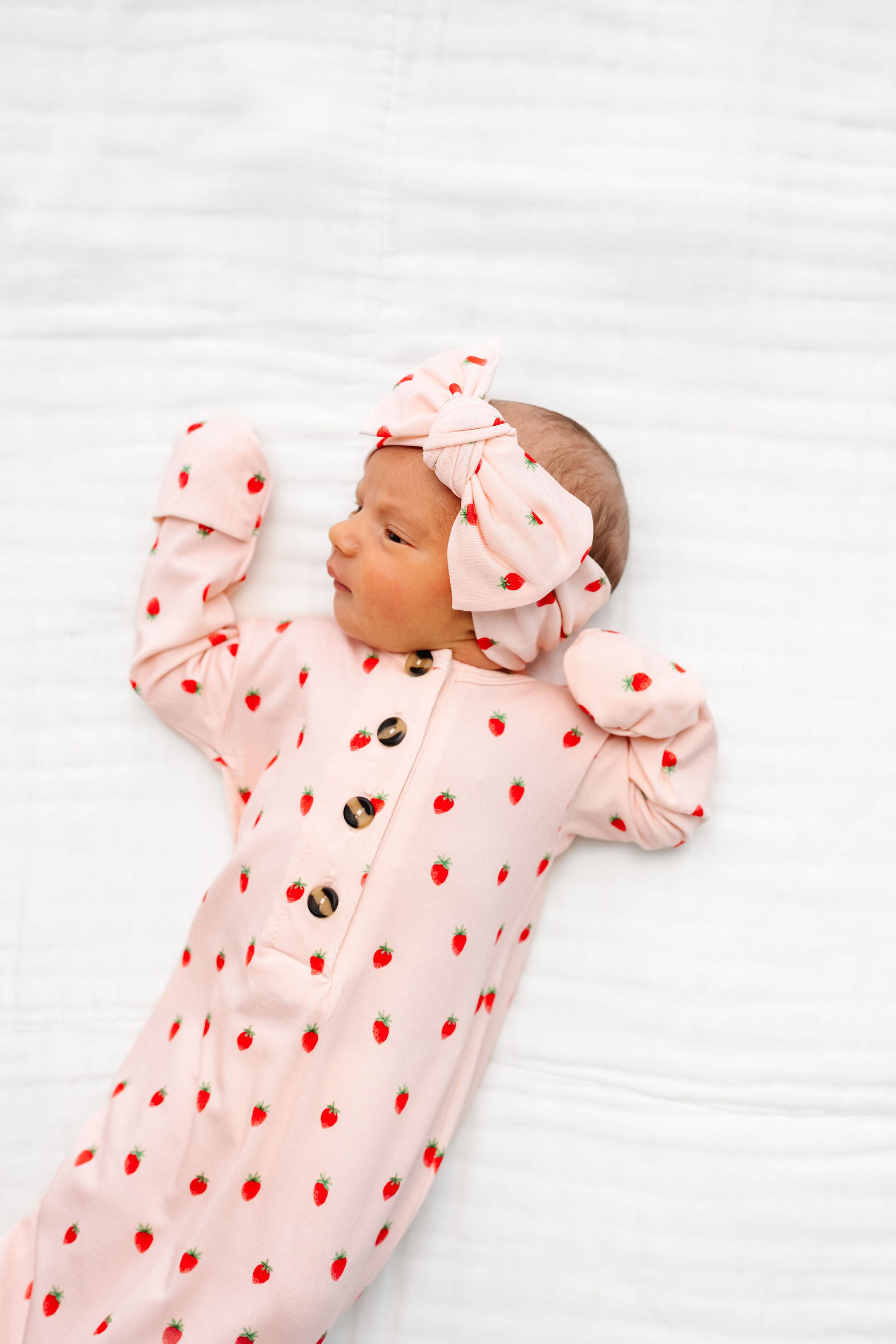 junie knotted gown strawberry print. newborn girl with matching headband