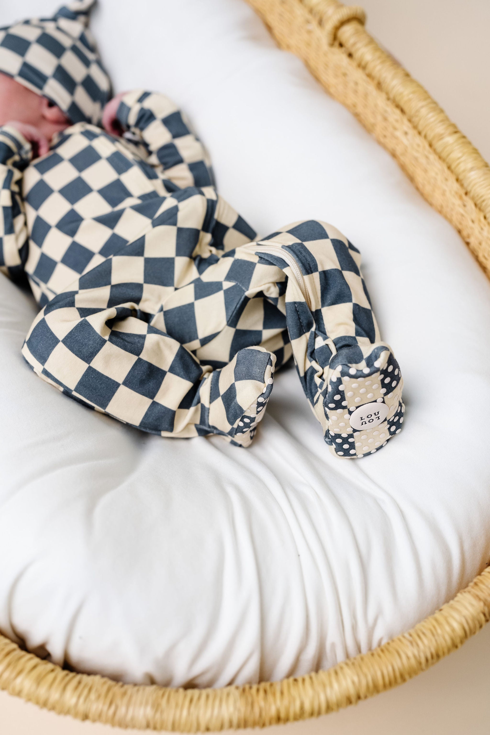 miles zipper footies close up on print and grip - newborn boy in bassinet