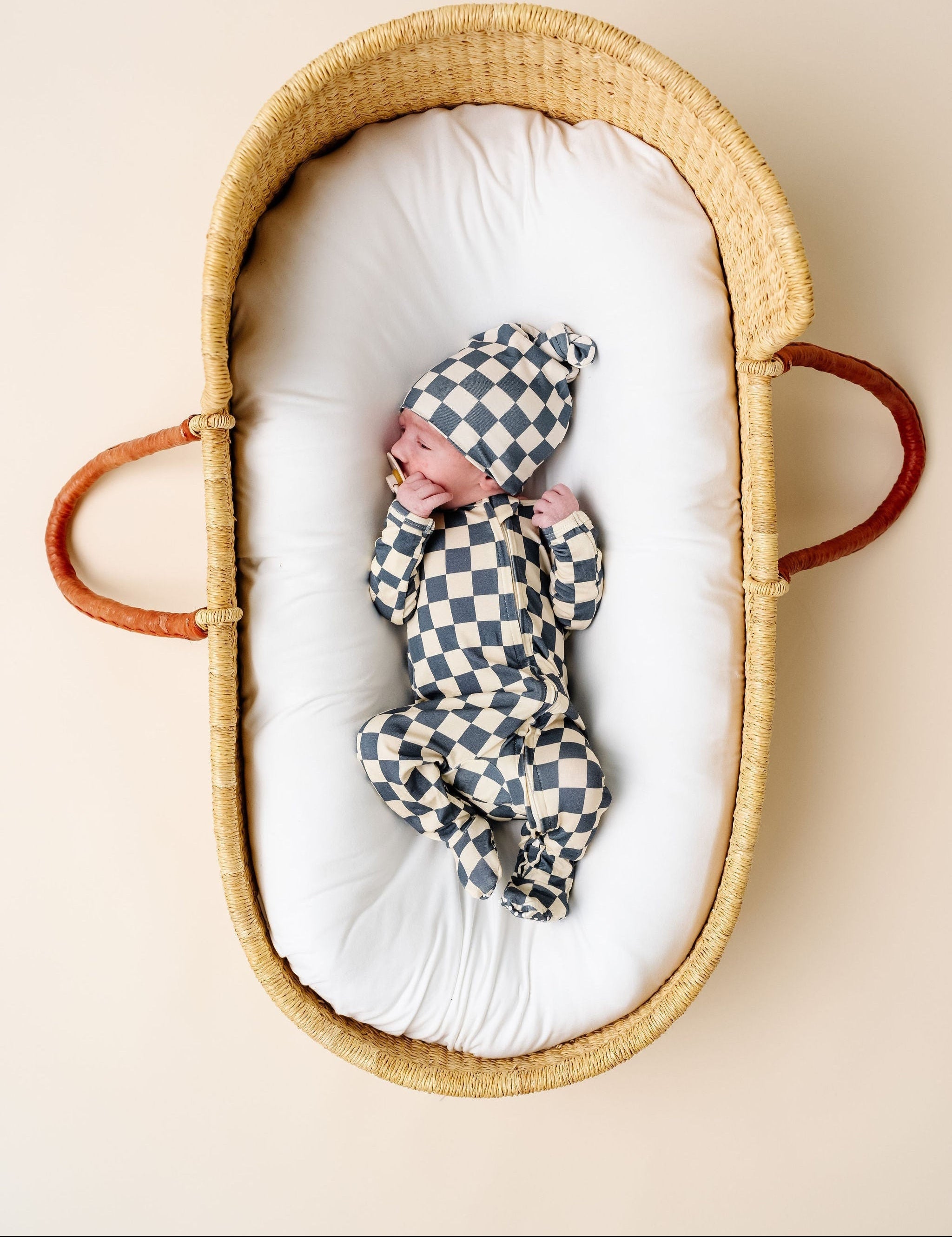 miles zipper footies newborn boy in bassinet