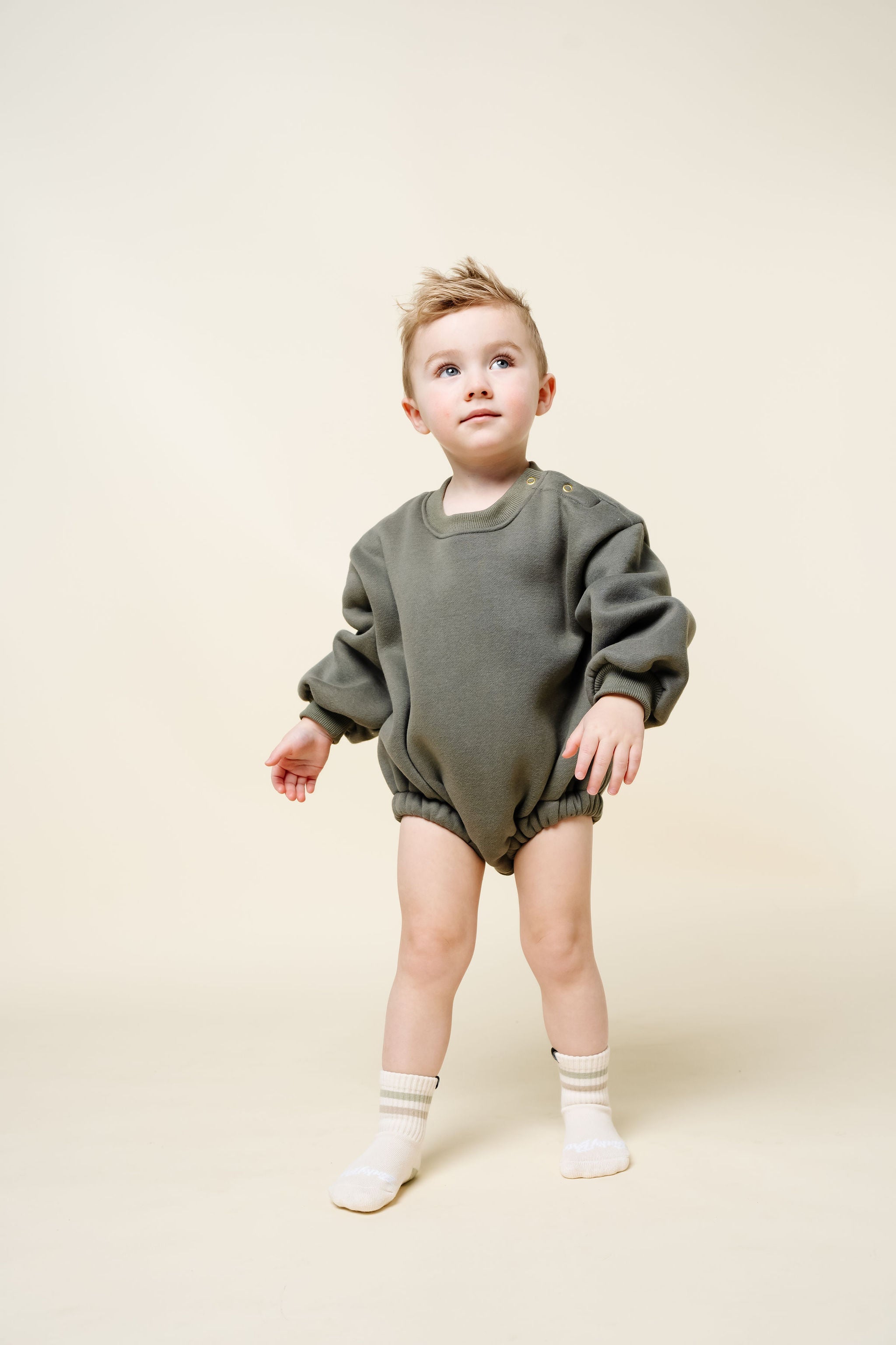 olive sweatshirt romper toddler boy standing