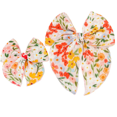Floral-patterned hair bows on a white background