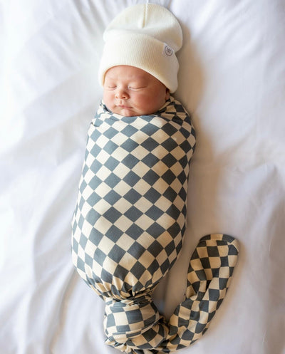 UGC content of Baby boy in miles swaddle and ivory beanie.