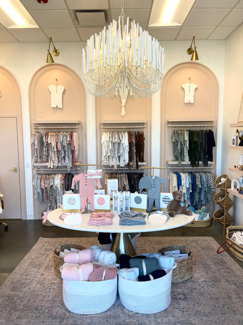 our storefront located in Orem utah. Picture of our storefront with baby clothing, swaddles, chenille blankets, toys, and stuffed animals. 