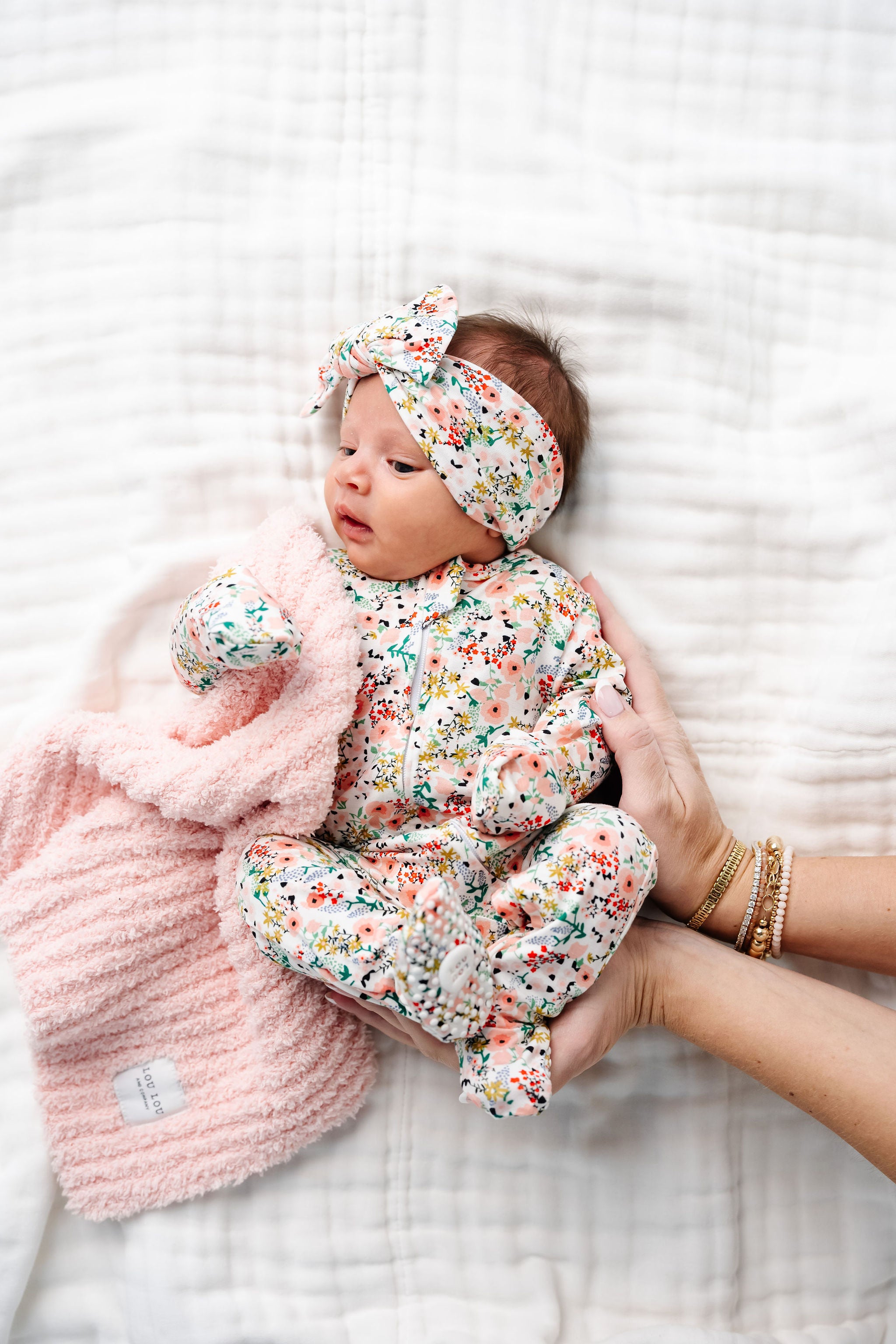 Millie Zipper Footies Newborn girl in newborn size with matching millie headband and blush chenille mini blanket