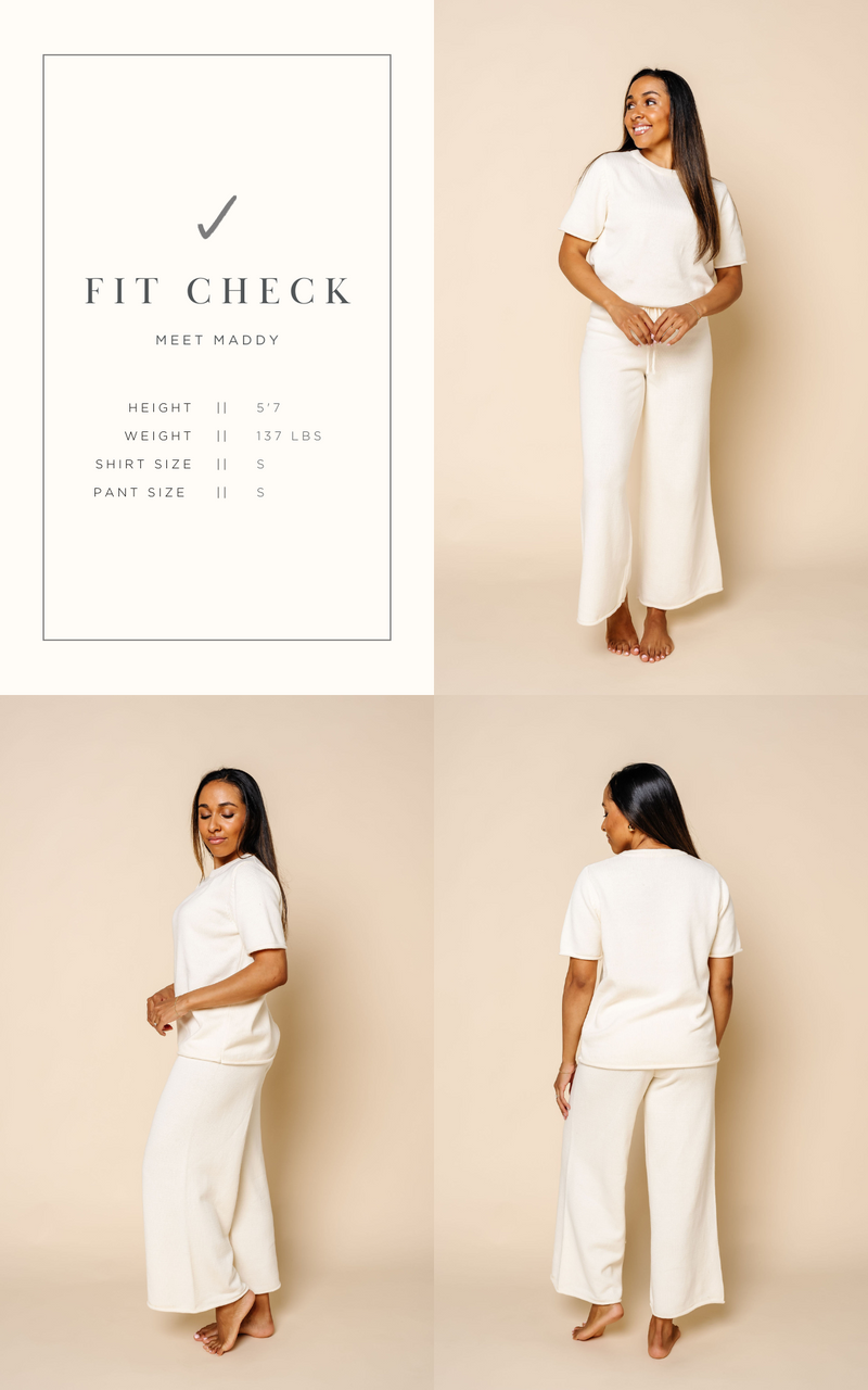 fit check graphic that shows maddy and the size she is wearing size small in the knit women's short sleeve tee and wide leg pants.  