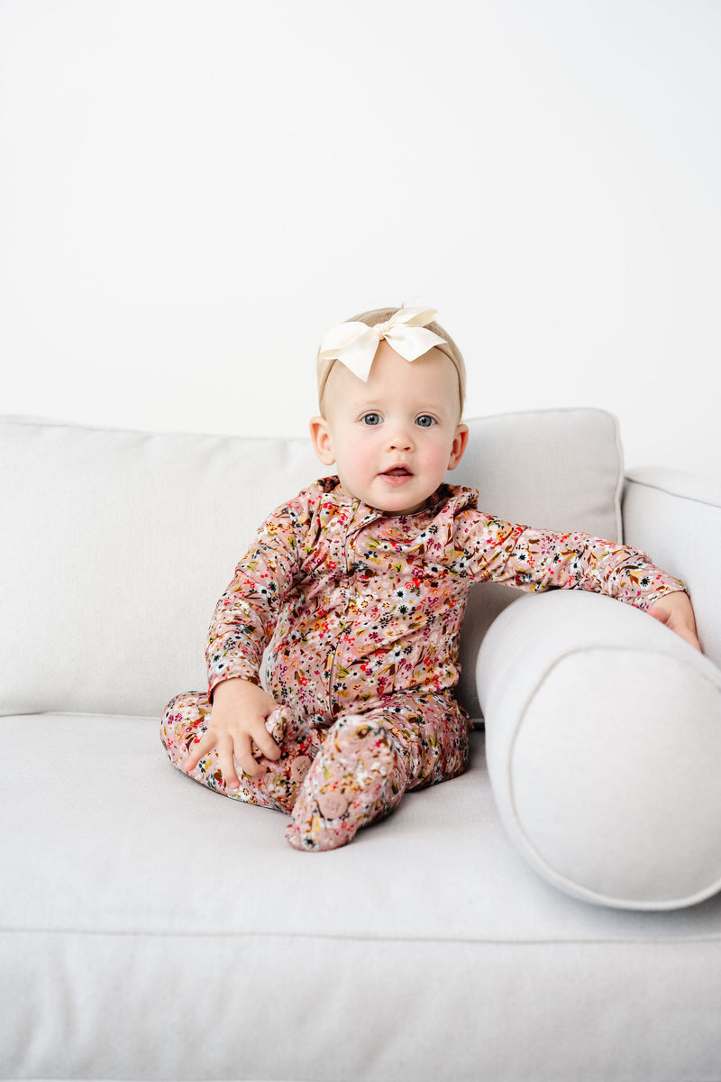 penelope zipper foties toddler girl in 12-24 month size sitting on couch