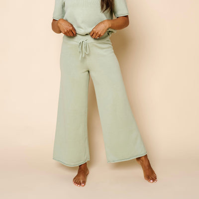 Women wearing Sage Knit Short Sleeve Tee & Wide Leg Pants. Wearing size Small close up on just the pants.